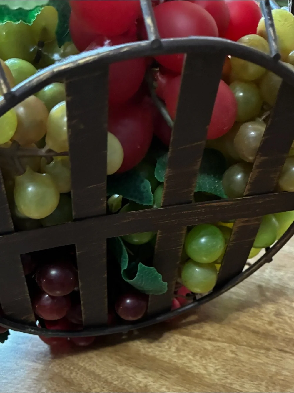 decorative artificial grape clusters, in a wire basket 8” x 10”